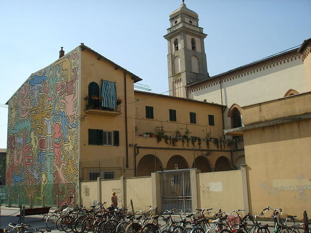 Haring's "Tuttomondo" op de zijkant van S. Antonio in Pisa