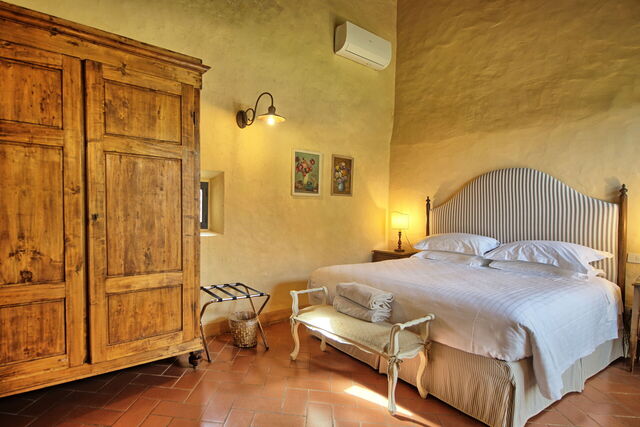 Een slaapkamer in Villa Cona